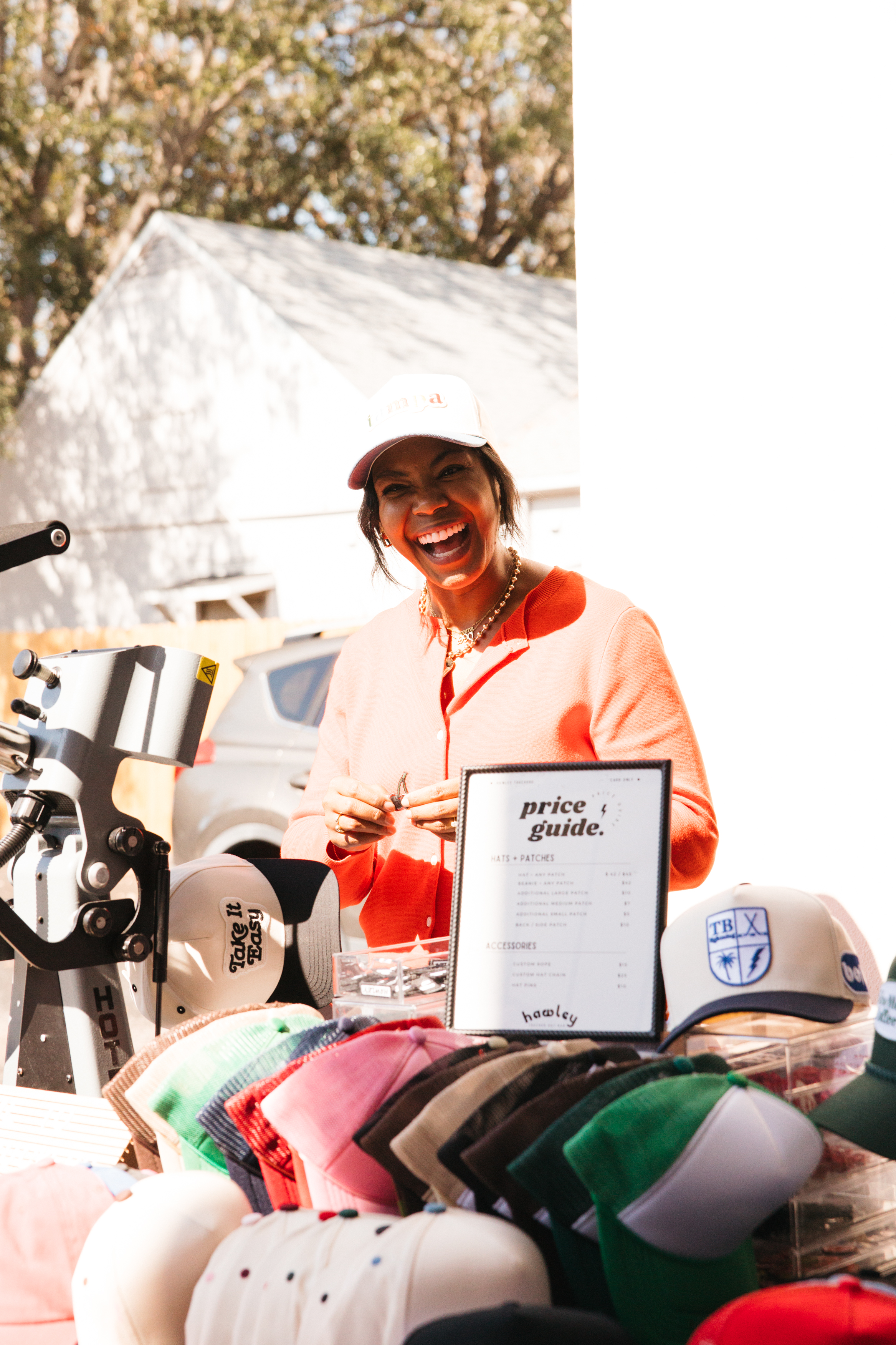 A host welcoming guests at an event check-in table